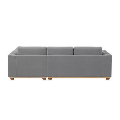 Laylah 3 Seater Hardwood Fabric Sofa with Right Chaise features a grey upholstery, wooden legs, and removable cushions, showcasing a contemporary design ideal for modern living spaces.