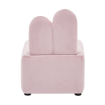 Lenore Velvet Plush Bunny Cushioned Kids Chair features a light pink, velvet texture with adorable bunny ears as a backrest, offering a whimsical and plush seating option for children.