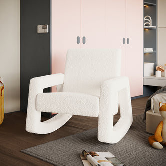 Ligeia Boucle Plush Cushioned Rocking Chair in Cream White, featuring boucle-style upholstery, thick foam padding, and trapezoid-shaped rocking legs, nestled in a cozy, contemporary reading nook setting.