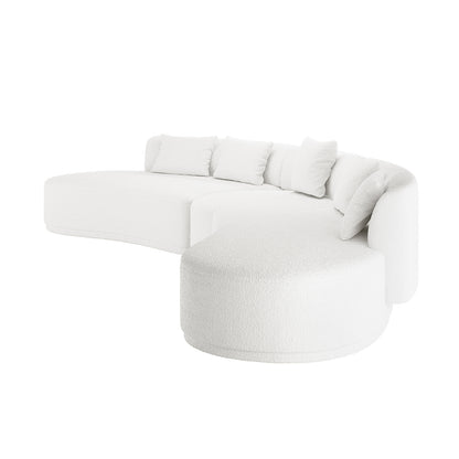 Lyana 7 Seater Bouclé Sofa Set in Cream White features a modern, curved design with an S-shaped seating arrangement, including a chaise extension and five loose back cushions, offering minimalist elegance.