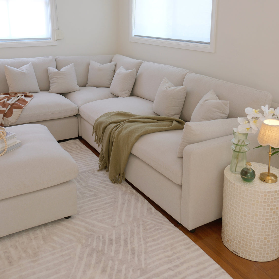 Millie 6-Seater Fabric Corner Chaise Sofa Light Beige, showcasing its modular design with deep seats, plush cushions, and robust frame, creating a comfortable and spacious seating area.