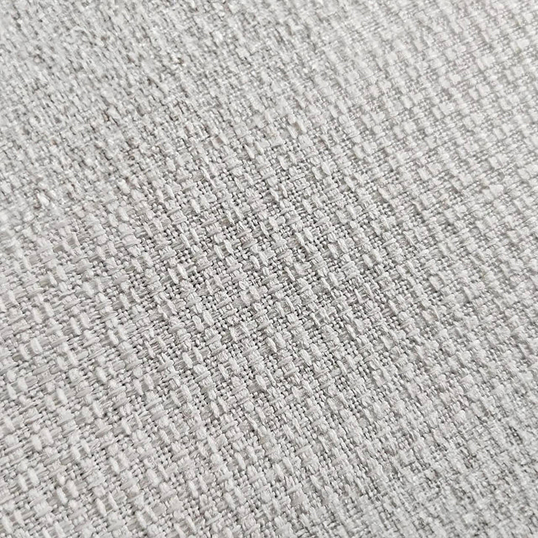 Close-up of the Millie Fabric Ottoman Modular Sofa in warm light grey, showcasing its smooth fabric texture and plush, deep seating, ideal for enhancing living room comfort and style.