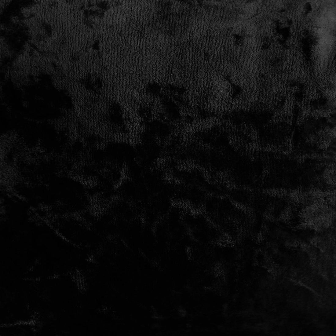 Norah 3 Seater Velvet Sofa in Black, showcasing a dark, textured surface resembling black velvet fabric, emphasizing its chic, contemporary design and luxurious feel, perfect for modern interiors.