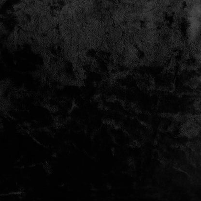 Norah 3 Seater Velvet Sofa in Black, showcasing a dark, textured surface resembling black velvet fabric, emphasizing its chic, contemporary design and luxurious feel, perfect for modern interiors.