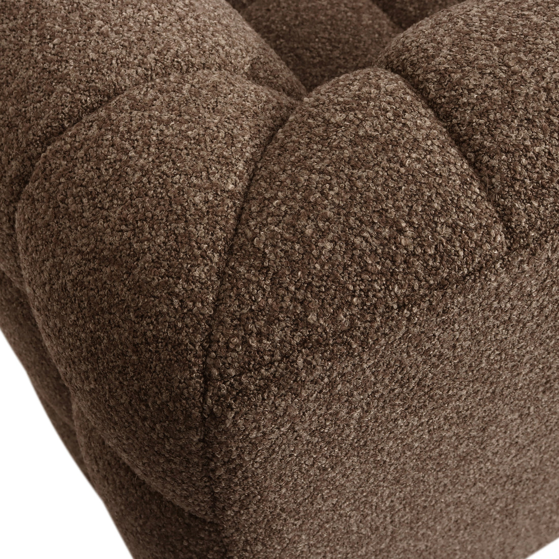 Close-up of the tufted upholstery on the Norah 3 Seater Boucle Sofa in Brown, showcasing its luxurious texture and craftsmanship, perfect for adding sophistication and comfort to your living space.