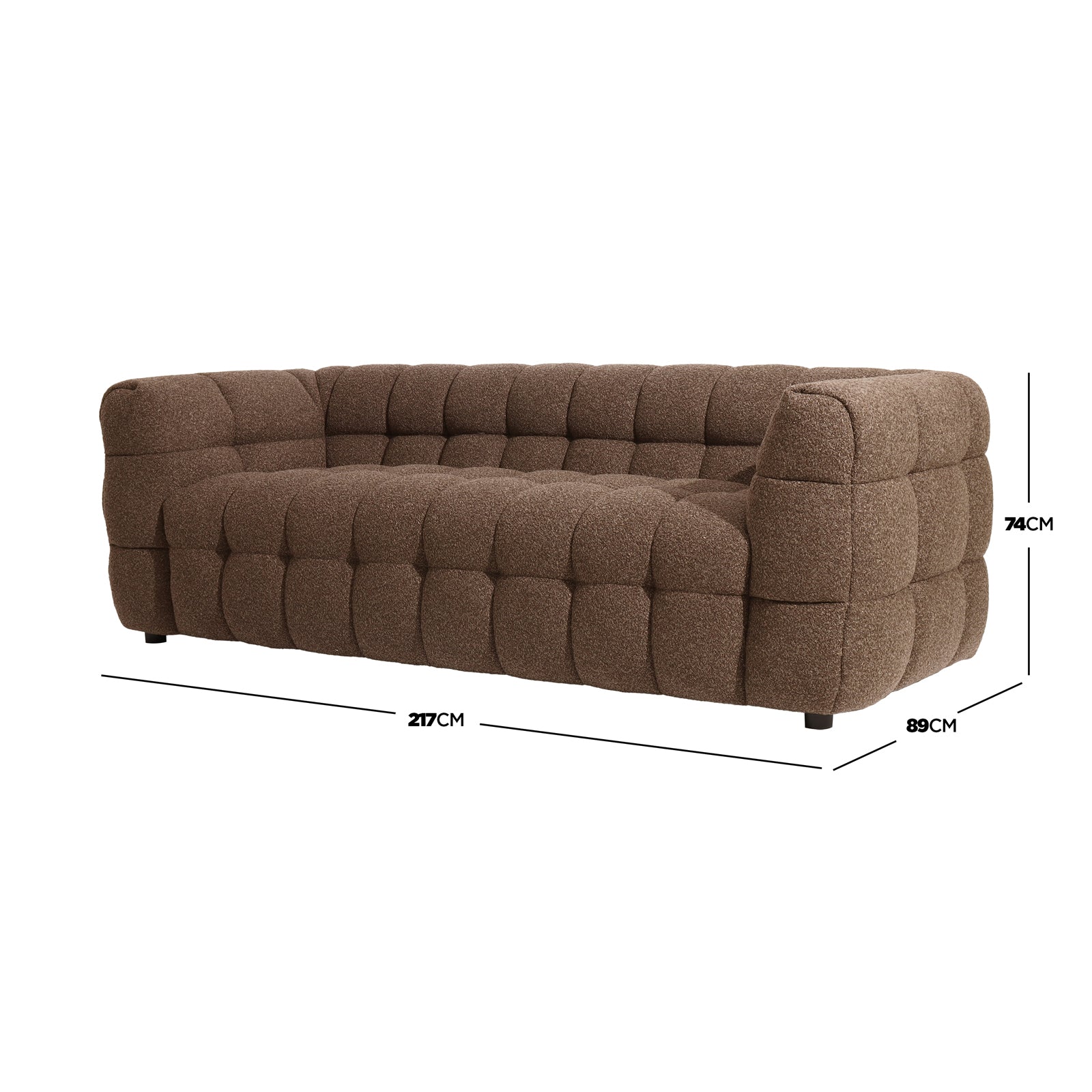 Norah 3 Seater Boucle Sofa in Brown, featuring a modern, low-profile design with heavily tufted fabric. Dimensions overlaid: 217cm width, 89cm depth, 74cm height.
