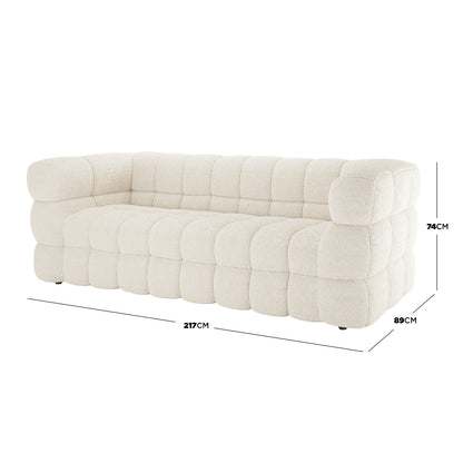 Norah 3 Seater Boucle Sofa in Cream White features quilted, block-tufted cushions in textured fabric, showcasing a modern design with dimensions: 217cm width, 89cm depth, 74cm height.