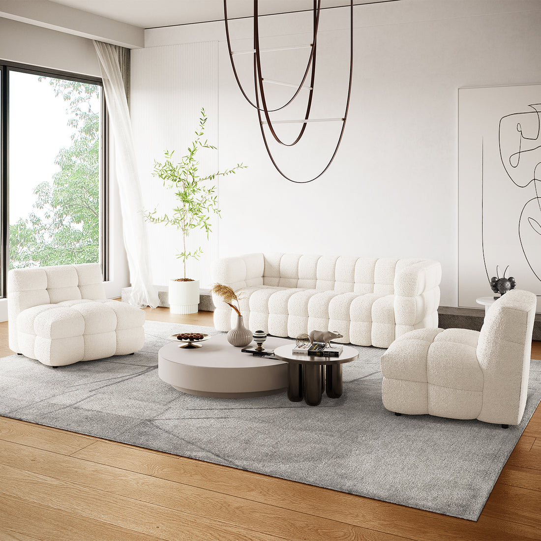 Norah 5 Seater Boucle Fabric Sofa Set in Cream White, featuring a tufted three-seat sofa and two armless chairs, styled with round coffee tables and a light-gray area rug in a bright living room.
