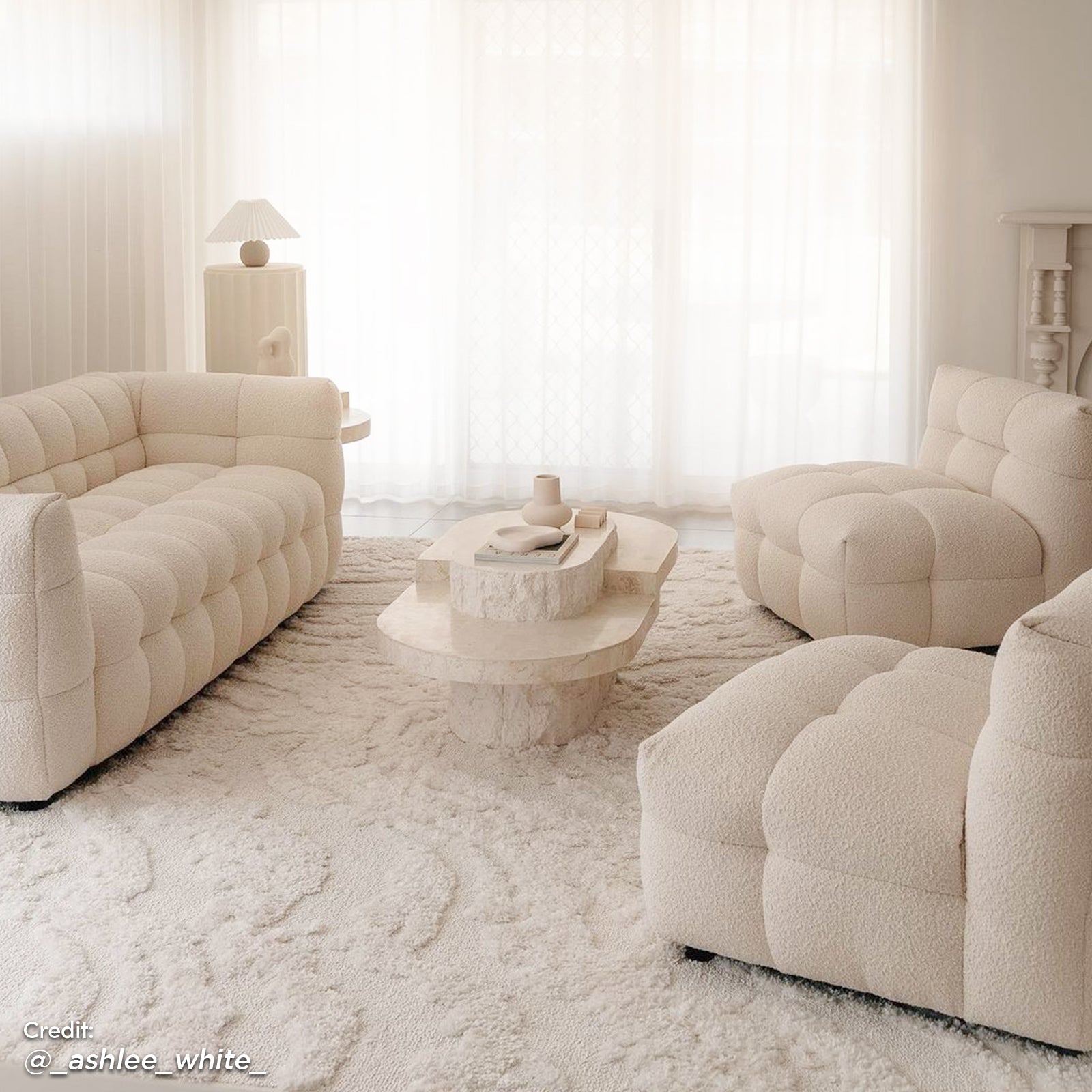 Norah 5 Seater Boucle Fabric Sofa Set in Cream White featuring a plush, tufted design. Includes two armless chairs and a loveseat on a high-pile rug, creating a serene, modern-minimalist living room.