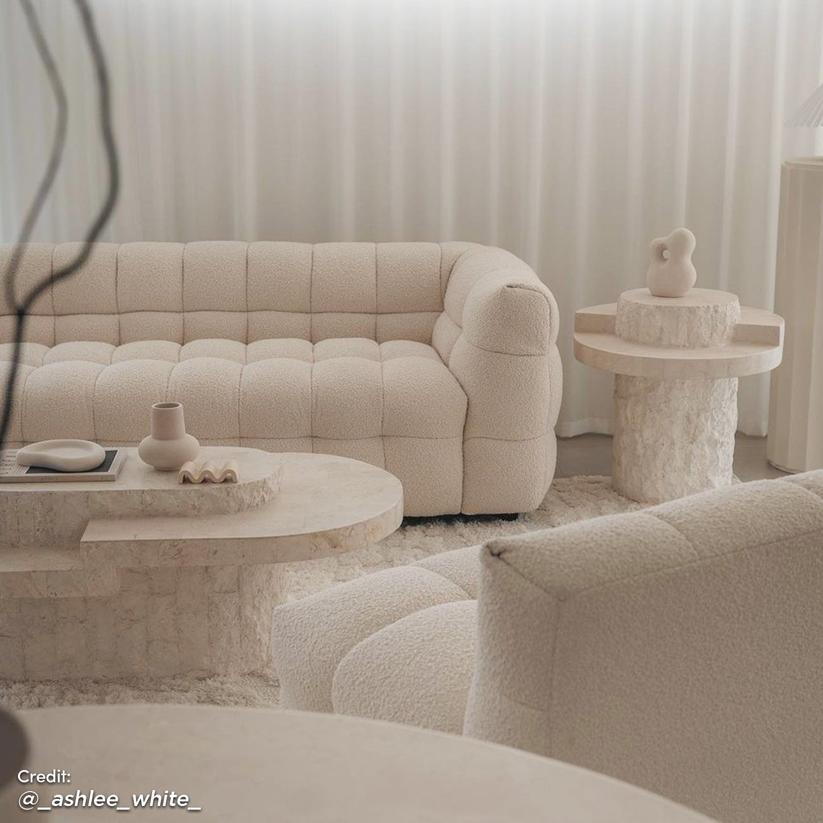 Norah 5 Seater Boucle Fabric Sofa Set in Cream White featuring a tufted design with plush, armless chairs, arranged in a serene, minimalist living space with matching coffee and side tables.