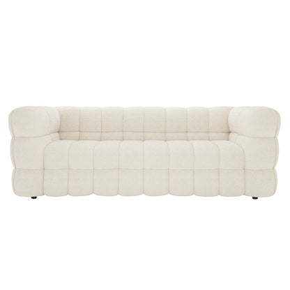 Norah 5 Seater Boucle Fabric Sofa Set in Cream White features a modern design with cream-colored upholstery, deep tufting, and blocky cushion modules, exuding elegance and versatility for any living space.