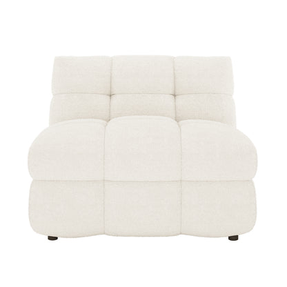The Norah 5 Seater Boucle Fabric Sofa Set in Cream White features an armless lounge module with deeply tufted, quilted pillows, showcasing its plush, modular design for a modern living room.