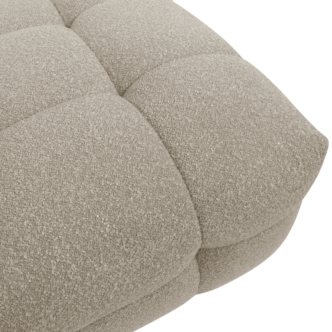 Close-up of the Norah 5-Seater Boucle Sofa Set with Armless Chairs in Warm Beige, highlighting the tufted, looped-yarn fabric of a cushion, showcasing its plush texture and elegant design.
