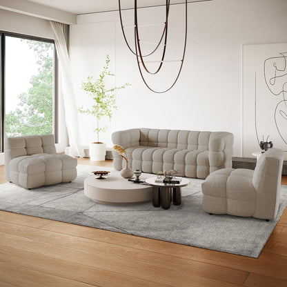 Norah 5-Seater Boucle Sofa Set with Armless Chairs in Warm Beige features an L-shaped tufted design, complemented by matching lounge chairs and round coffee tables, creating a contemporary, inviting living space.