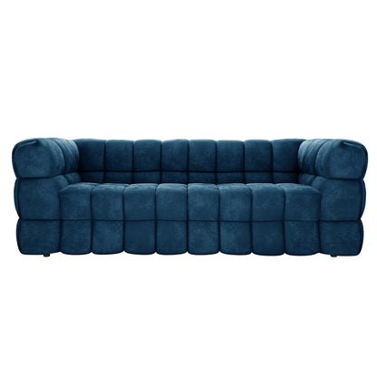 Modern Norah 5 Seater Velvet Sofa Set in blue with tufted block design, matching arms and back height, and low feet, offering luxurious seating and modular versatility with an included ottoman.