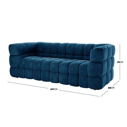 Norah 5 Seater Velvet Sofa Set with Ottoman in Blue, featuring a modern, deeply tufted design with square segments, dimensions marked as 217 cm wide, 89 cm deep, and 74 cm tall.