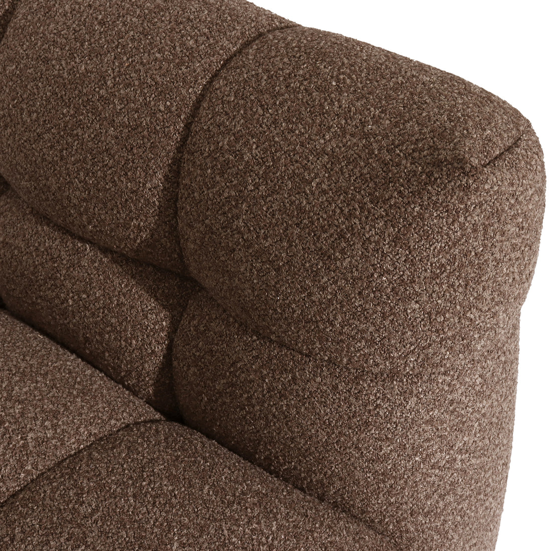 Close-up of the Norah 5 Seater Boucle Sofa Set With Ottoman in Brown, showcasing the brown boucle fabric's textured, tightly looped upholstery on a cushion, highlighting modern elegance and plush comfort.