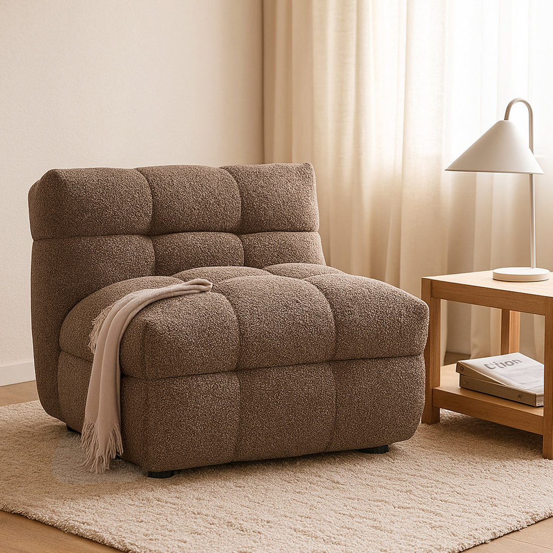 Norah Boucle Single Seater Sofa in Brown features a textured, tufted design with a draped throw, set on an off-white rug beside a wooden side table and lamp.