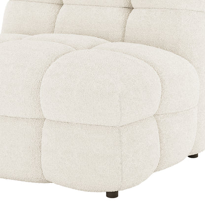 Norah Single Seater Boucle Sofa in Cream White featuring tufted, padded blocks in soft boucle fabric with a visible black leg, epitomizing modern elegance and comfort.