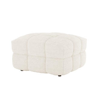 Norah Boucle Ottoman in Cream White, a low, cube-shaped ottoman with tufted, rounded panels and soft boucle fabric, sitting on small, barely visible legs. Perfect for adding comfort and style.