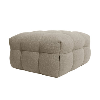 Norah Boucle Ottoman in Warm Beige, featuring a low, rectangular shape with light-beige boucle upholstery, soft tufted squares, and a pillowy appearance, showcasing comfort and elegant design.