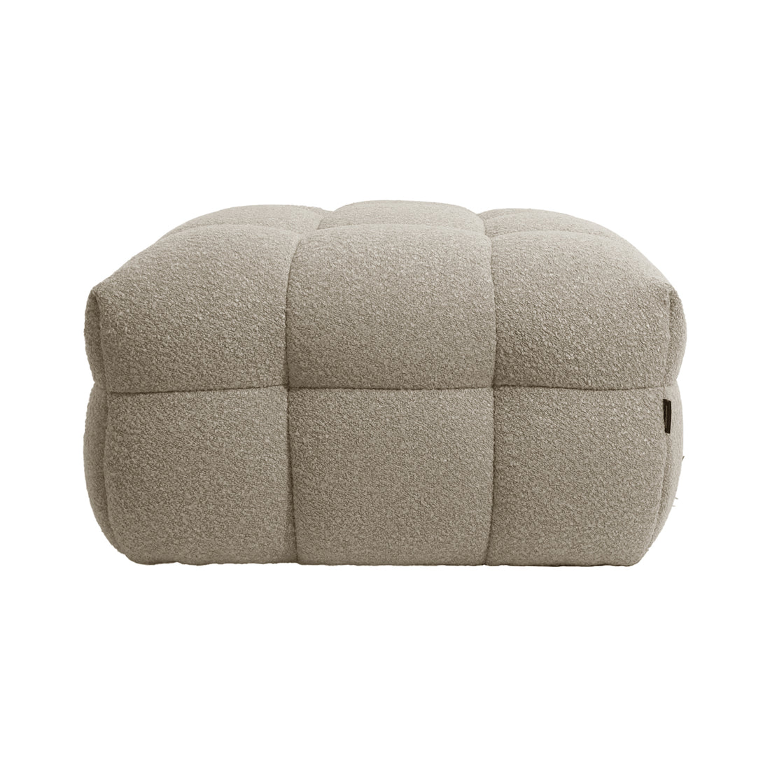 Norah Boucle Ottoman in Warm Beige, featuring a square shape with quilted, tufted blocks, upholstered in textured bouclé fabric, offering a soft, padded look for a stylish and functional accent piece.
