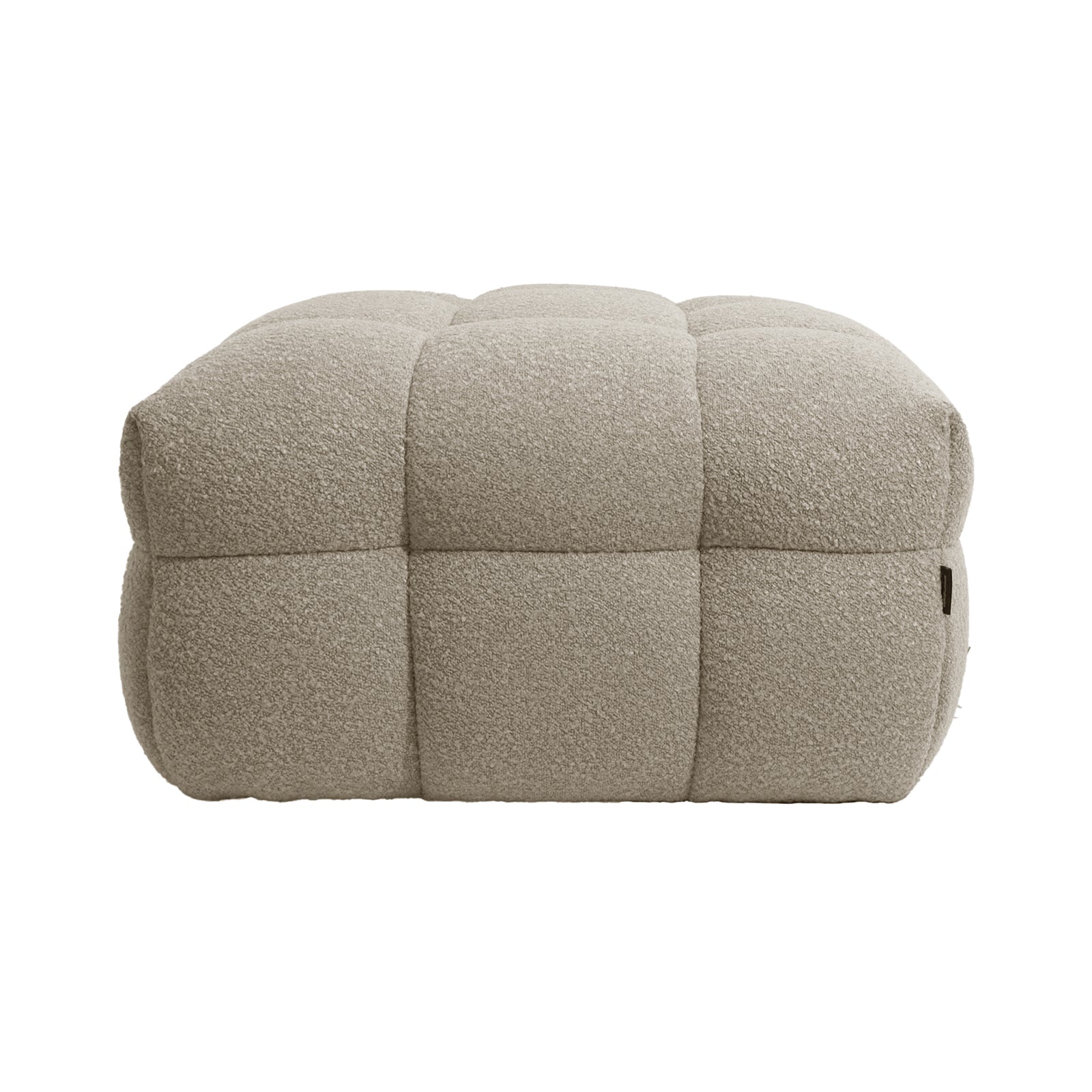 Norah Boucle Ottoman in Warm Beige, featuring a square shape with quilted, tufted blocks, upholstered in textured bouclé fabric, offering a soft, padded look for a stylish and functional accent piece.