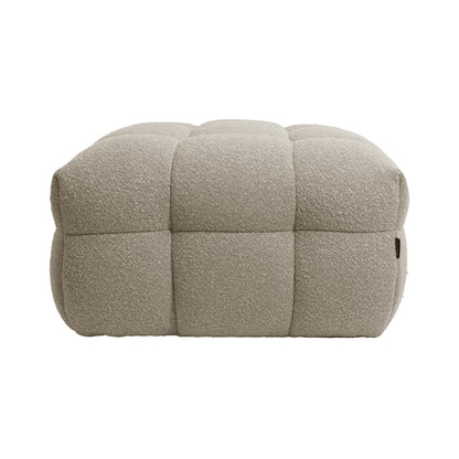Norah Boucle Ottoman in Warm Beige, featuring a square shape with quilted, tufted blocks, upholstered in textured bouclé fabric, offering a soft, padded look for a stylish and functional accent piece.