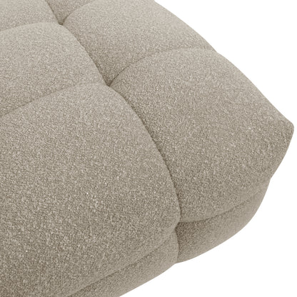 Close-up of the Norah 5 Seater Boucle Sofa Set With Ottoman in Warm Beige, showcasing its tufted, padded cushion upholstered in light-beige, loop-textured bouclé fabric for a plush, elegant look.