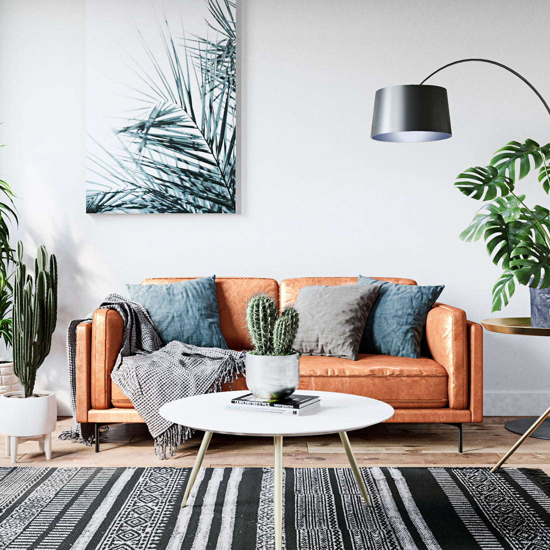 Oslo 3 Seater PU Leather Sofa Mocha on display with a cactus in a pot nearby, showcasing its PU leather upholstery, sturdy metal legs, and comfortable design in a living room setting.
