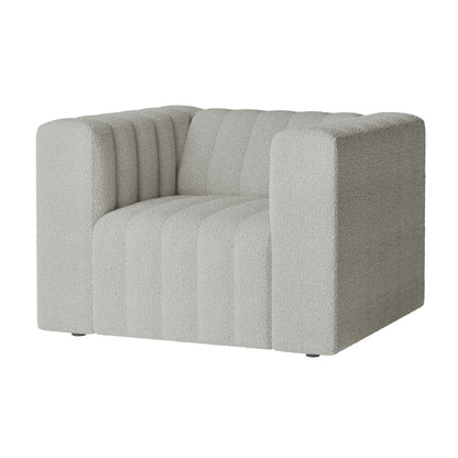 Parisa 1 Seater Tufted Boucle Sofa in Light Grey, featuring a chunky, boxy silhouette with wide arms and vertical channel-stitched cushioning, upholstered in luxurious bouclé-style fabric.
