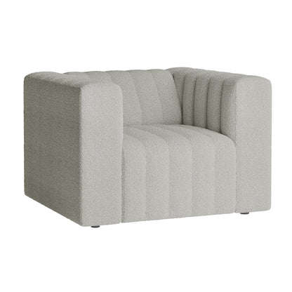 The Parisa 4 Seater Tufted Boucle Sofa Set in Light Grey features a single-seat armchair with a blocky design, wide arms, vertical channel tufting, and light-gray textured fabric upholstery.