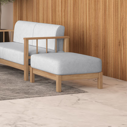 Raylai Hardwood American Oak Ottoman in Grey Fabric, featuring a minimalist design with a light gray upholstered cushion on a sturdy wooden frame, set on a neutral woven rug.