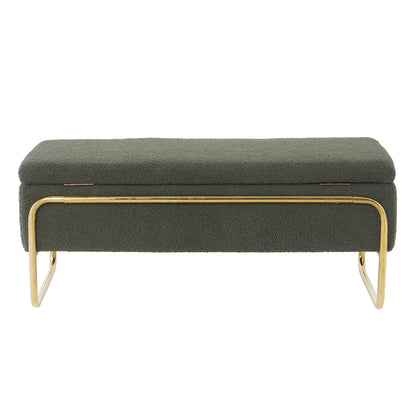 Riane Boucle Storage Ottoman in Green, featuring a textured bouclé fabric, hinged top for storage, and supported by polished brass tubular metal legs and front rail, exuding modern elegance.