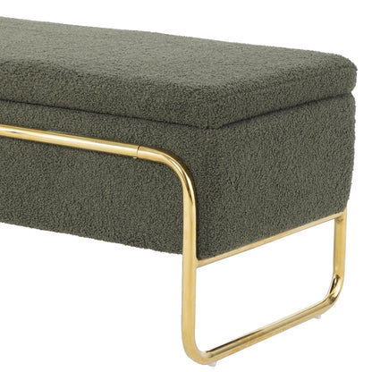 Riane Boucle Storage Ottoman in Green: A low, rectangular ottoman featuring deep olive-green boucle fabric, resting atop a sleek U-shaped polished gold metal frame, highlighting modern elegance and hidden storage.