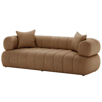 Samira 5 Seater Velvet Sofa Set - Camel Brown, showcasing a plush velvet texture with detailed cushioning, accompanied by a matching brown pillow, highlighting the luxurious and comfortable seating design.