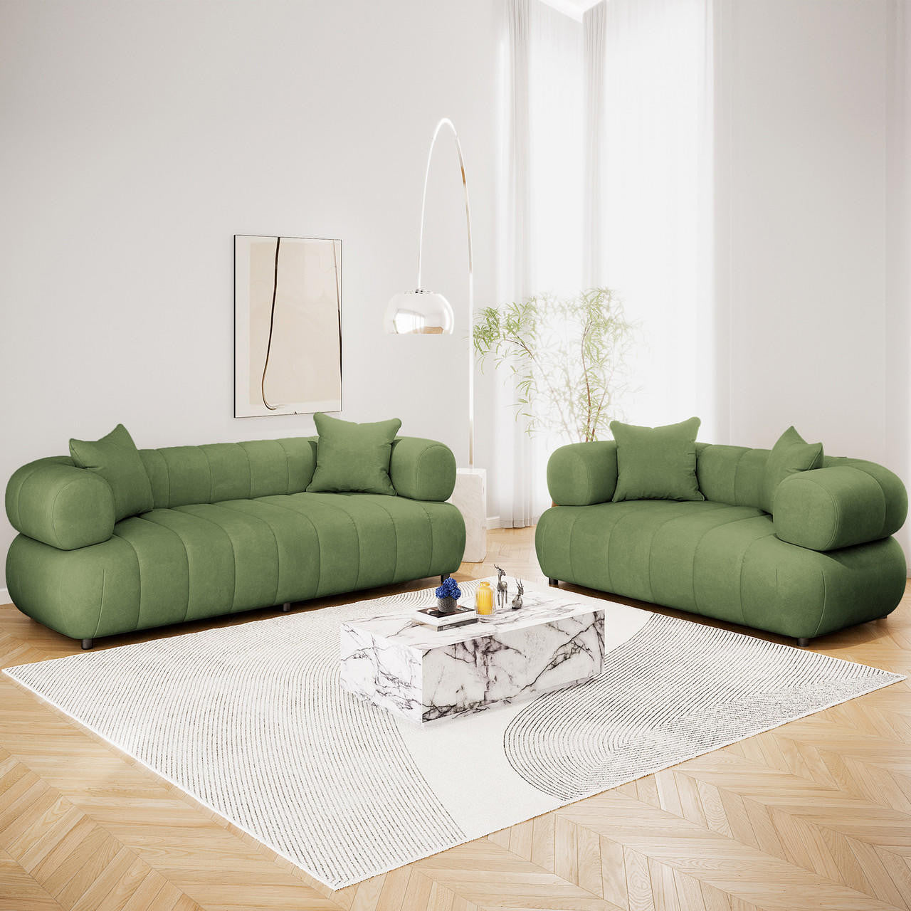 Samira 5 Seater Velvet Sofa Set in Prasinous Green features plush, rounded sofas with matching throw pillows, centered in a minimalist living room, exuding elegance and comfort around a marble coffee table.
