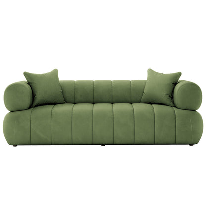 Samira 5 Seater Velvet Sofa Set in Prasinous Green features a modern design with a low tufted back, bolster arms, and matching throw pillows, creating a stylish and inviting lounge piece.