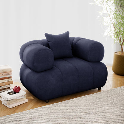 Samira Single Seater Velvet Sofa - Navy Blue, featuring plush velvet upholstery, a single pillow for added comfort, and a sleek, modern design, positioned in a cozy, stylish living space.