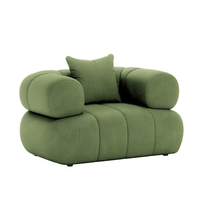 Samira Single Seater Velvet Sofa in Prasinous Green features a plush, oversized design with rounded tubular armrests, padded back, and muted green velvet upholstery, resting on barely-visible feet.