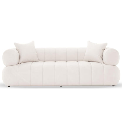 Samira 6 Seater Velvet Sofa Set in Cream features a modern, low-profile design with channel-stitched base and back, cylindrical bolster cushions at armrests, and two matching throw pillows on each end.