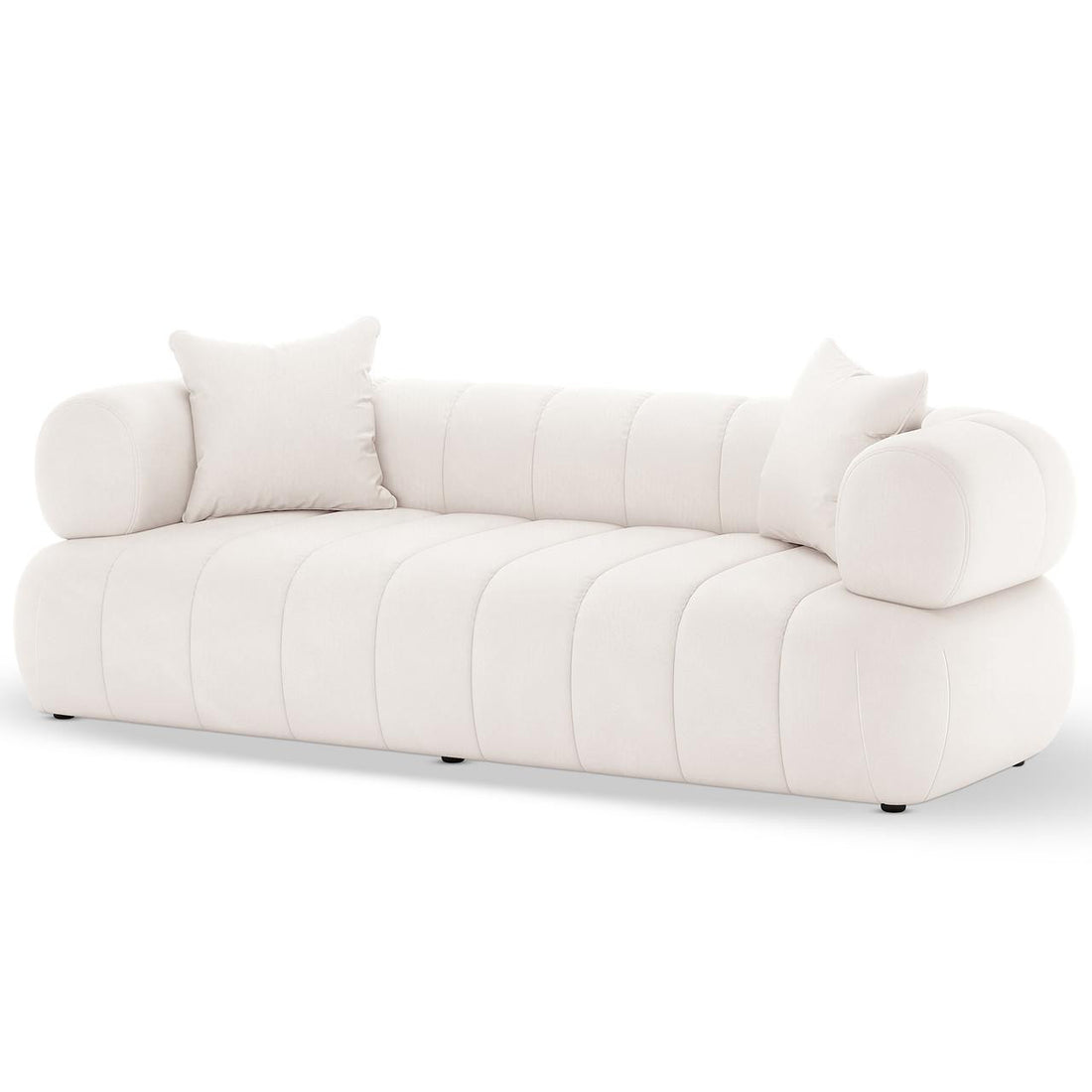 Samira 6 Seater Velvet Sofa Set in Cream features a modern, low-profile design with channel-stitched upholstery, cylindrical bolster arms, and matching throw pillows, epitomizing elegance and plush comfort.