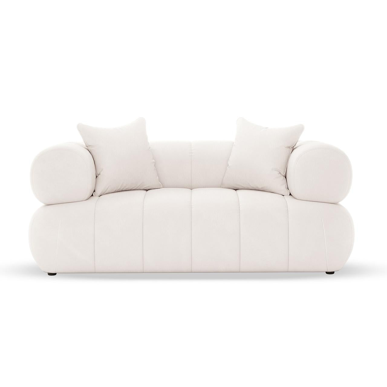 Samira 6 Seater Velvet Sofa Set in Cream, featuring a modern low-profile design with two square throw pillows and cylindrical bolster cushions, offers an inviting and elegant seating arrangement.