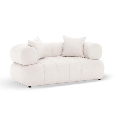 Samira 6 Seater Velvet Sofa Set in Cream features a modern, low-profile design with channel-stitched base, cylindrical bolsters, and two square pillows, perfect for contemporary, spacious living.