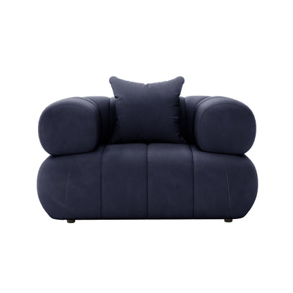 Samira 6 Seater Velvet Sofa Set - Navy Blue, showcasing its plush pillow on a blue chair, highlighting the luxurious velvet texture and elegant design.