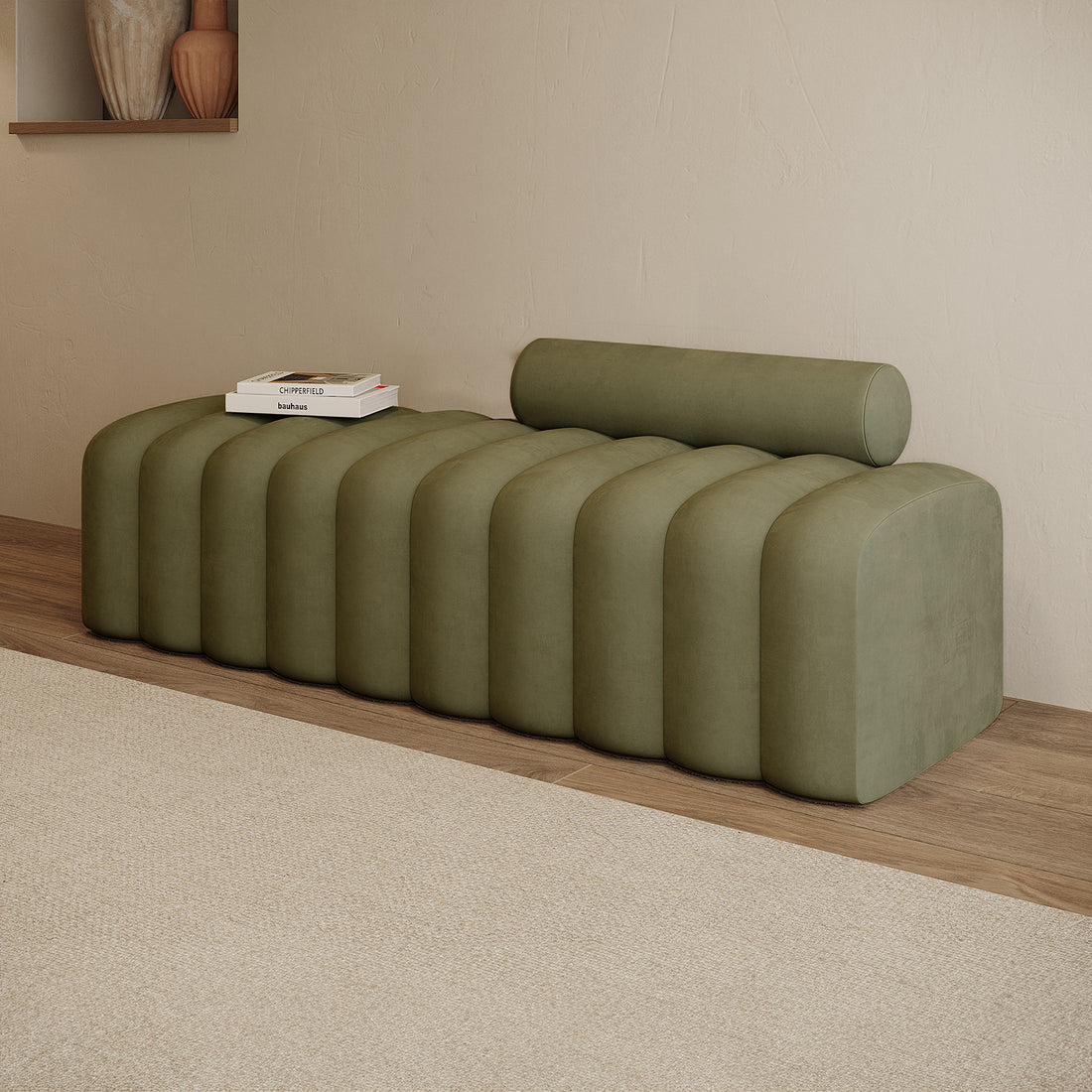 Sasa Velvet Tufted Fabric Bench with Backrest Sage, featuring evenly spaced rounded pillows and a removable cylindrical bolster cushion, set against a minimalist interior with stacked art books.