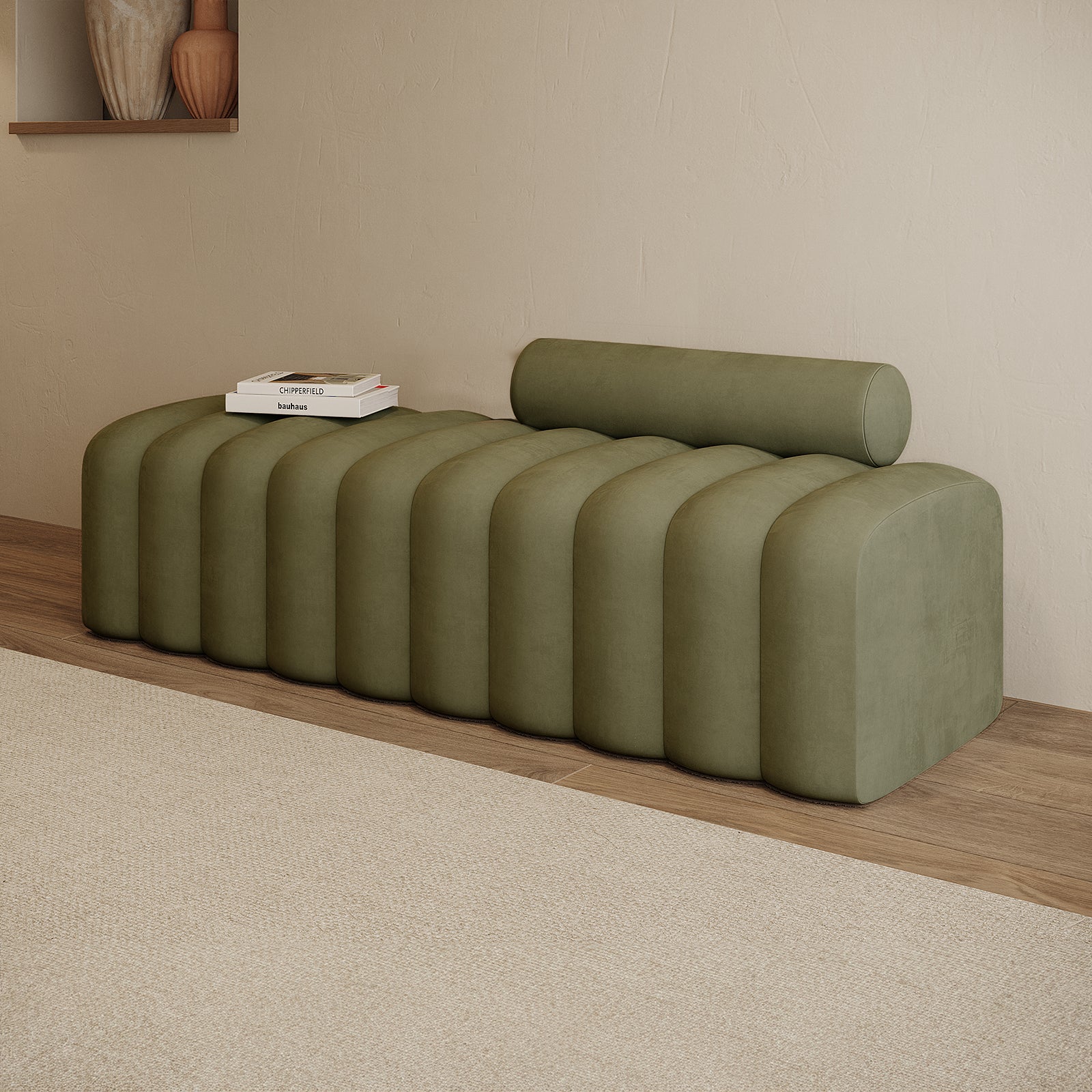 Sasa Velvet Tufted Fabric Bench with Backrest Sage, featuring evenly spaced rounded pillows and a removable cylindrical bolster cushion, set against a minimalist interior with stacked art books.