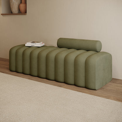 Sasa Velvet Tufted Fabric Bench with Backrest Sage, featuring evenly spaced rounded pillows and a removable cylindrical bolster cushion, set against a minimalist interior with stacked art books.