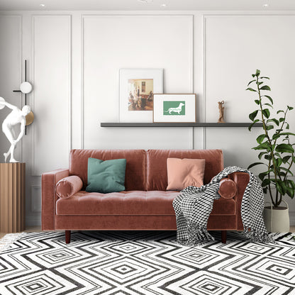 Sollia 3-Seater Velvet Sofa - Blush placed in a stylish interior, featuring a soft blush velvet finish, complemented by a green pillow and white statue, enhancing modern sophistication and comfort.