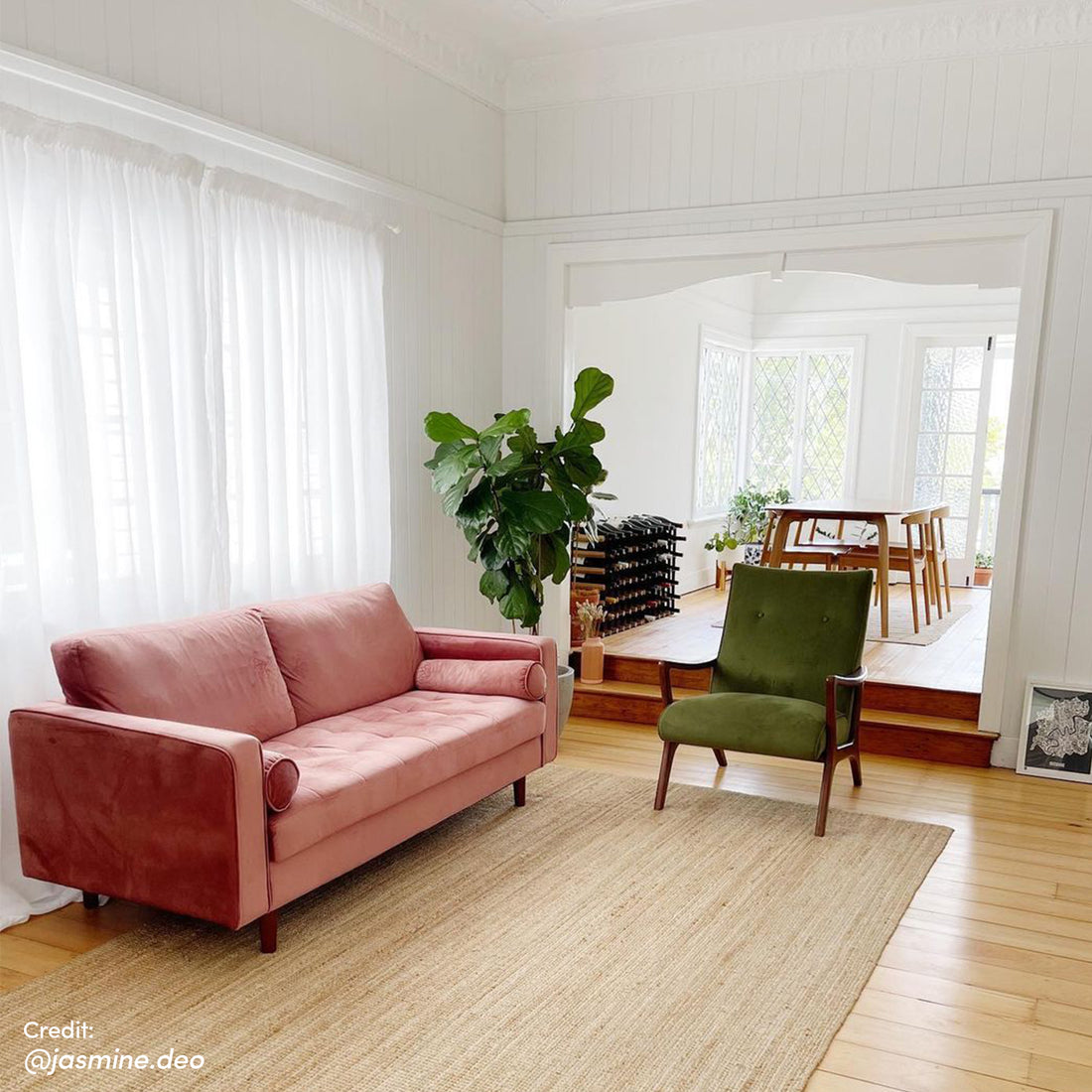 Sollia 3-Seater Velvet Sofa in Blush displayed in a stylish room, featuring plush velvet upholstery, matching bolster pillows, and sleek wooden feet, perfectly blending luxury and comfort.